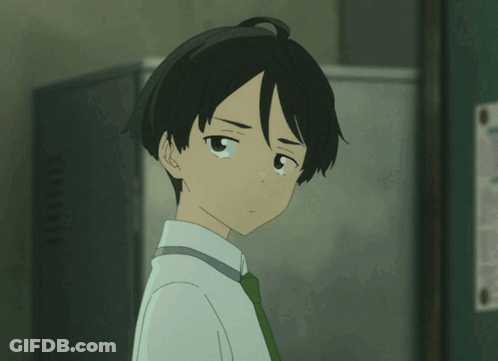 Boy In White Shirt And Green Tie Looking At Camera GIF