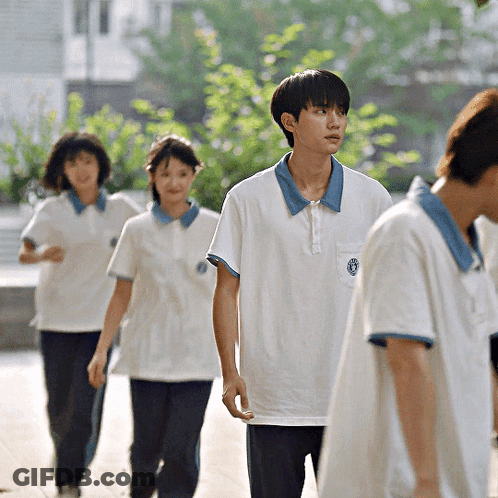 Boy In White Shirt With Blue Collar And Blue Circle GIF