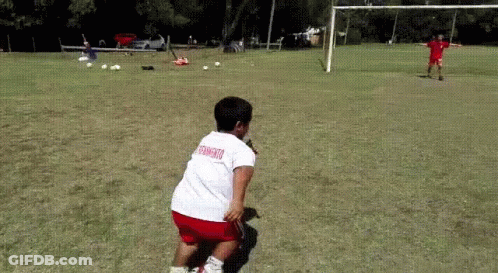 Boy In White Shirt With Soccer On Back Playing Soccer GIF