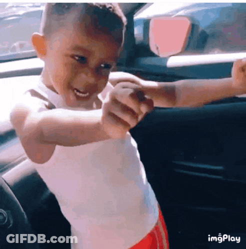 Boy In White Tank Red Shorts Standing Car GIF