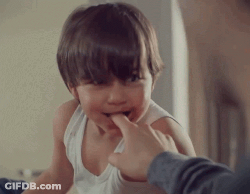 Boy In White Tank Top Biting Finger GIF