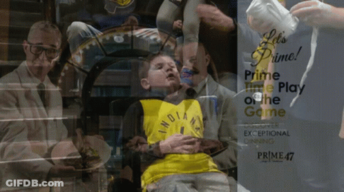 Boy In Yellow Indiana Jersey Sits In Front Of Prime Time Play Of The Game Poster GIF