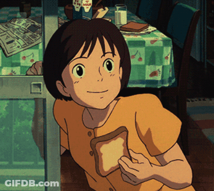 Boy In Yellow Shirt Holding Bread GIF