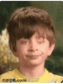Boy In Yellow Shirt Making Funny Face GIF