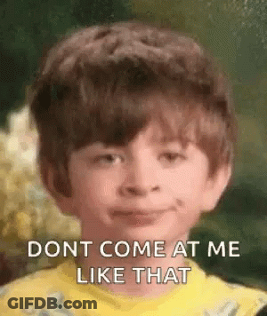 Boy In Yellow Shirt Making Funny Face GIF