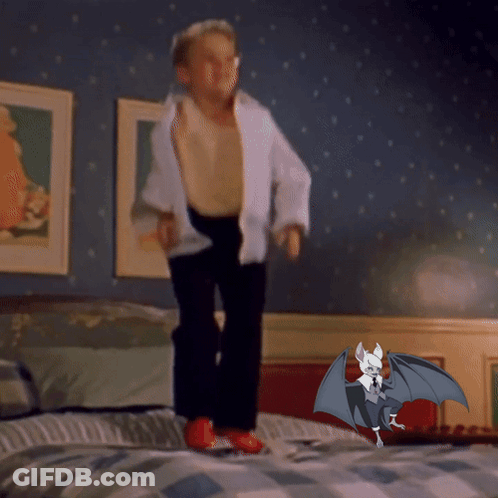 Boy Jumping On Bed Next To Bat With Wings GIF
