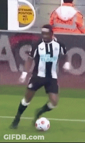 Boy Kicking Soccer Ball In Front Of House GIF