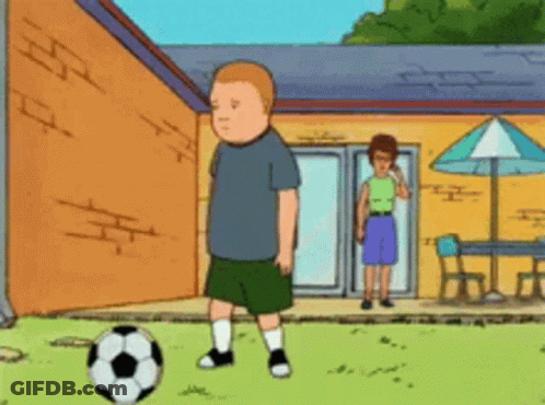 Boy Kicking Soccer Ball In Front Of House GIF