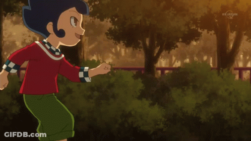 Boy Kicking Soccer Ball Near TV Station GIF