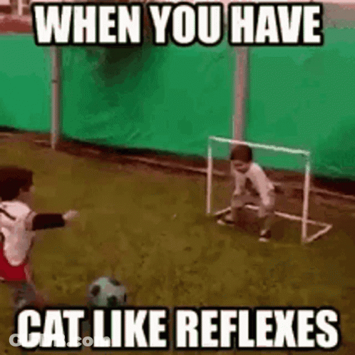 Boy Kicking Soccer Ball While Another Watches GIF
