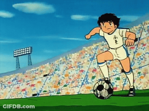Boy Kicking Soccer Ball With Chinese Writing On Jersey GIF