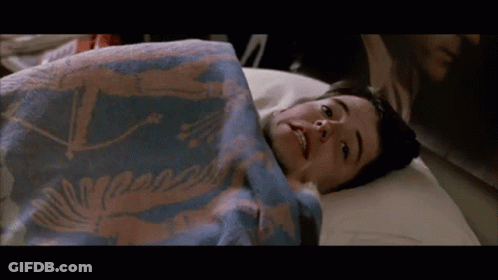Boy Laying On Bed With Blue Blanket Saying A GIF
