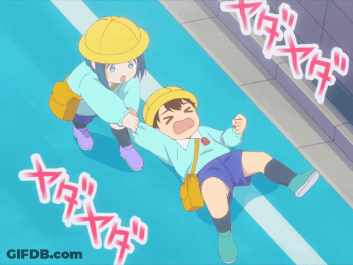 Boy Laying On Ground With Girl Standing Next To Him GIF