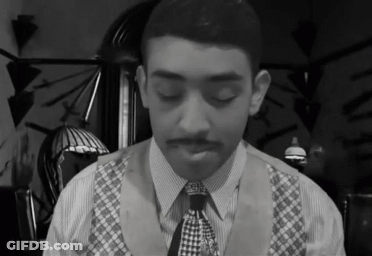 Boy Lighting And Smoking Cigar Grayscale GIF