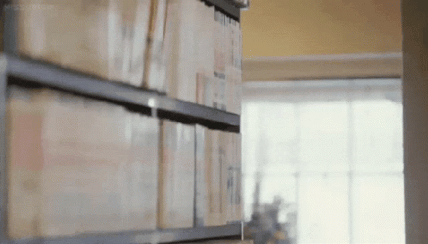 Boy Lurking Behind The Box GIF