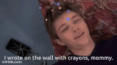 Boy Lying On Couch With Crayon Wall Art GIF