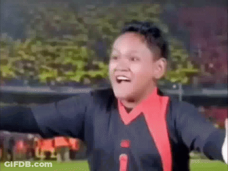 Boy Making Funny Face Arms Outstretched Soccer Field GIF