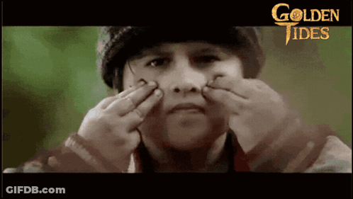 Boy Making Funny Face In Golden Tides Poster GIF