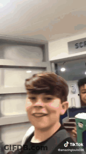 Boy Making Funny Face With Coffee GIF