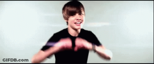 Boy Making Heart Shape GIF