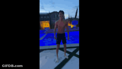 Boy On Ledge In Black Jacket Orange Shoes GIF