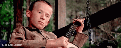 Boy On Porch Swing Playing Banjo GIF