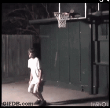 Boy Playing Basketball In Backyard At Night GIF