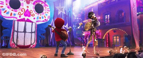 Boy Playing Guitar And Singing Into Microphone On Stage In Front Of Skeleton GIF