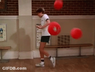 Boy Playing With Red Balls GIF