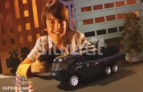 Boy Playing With Toy Kingdom Truck GIF