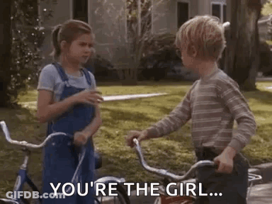 Boy Pointing At Girl On Bicycle GIF