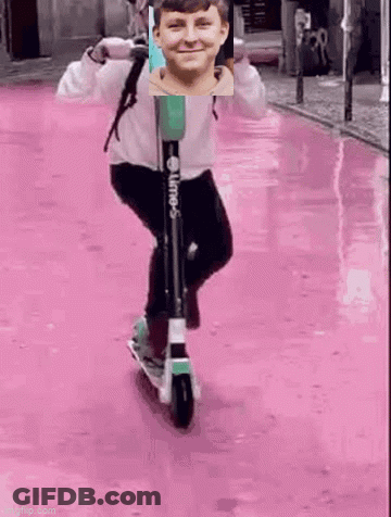Boy Riding Scooter On Pink Street GIF