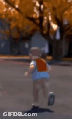 Boy Running Down Street GIF