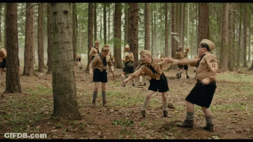 Boy Scouts In Woods With O On Uniform GIF
