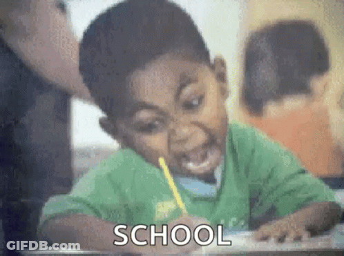Boy Sitting At Desk With Pencil GIF