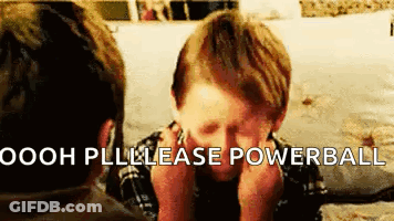 Boy Sitting At Table With Hands On Face GIF