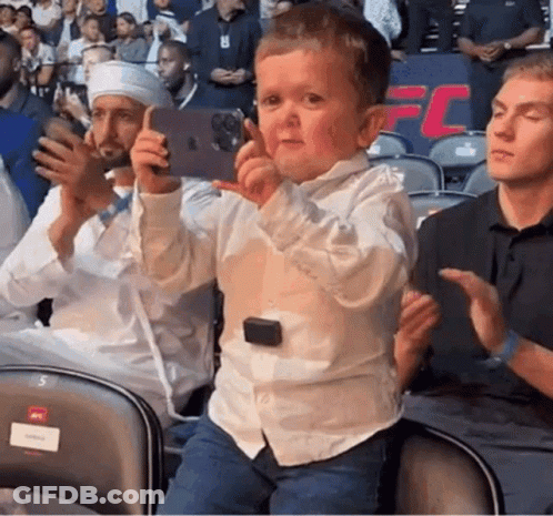 Boy Sitting In Chair Taking Selfie GIF