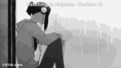 Boy Sitting In Front Of Window Wearing Headphones GIF
