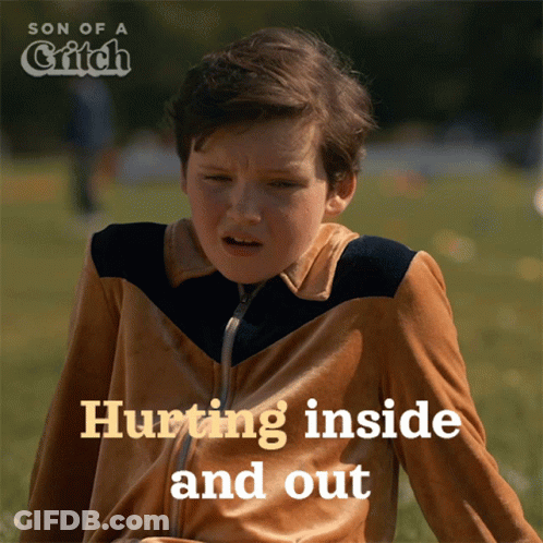Boy Sitting In Grass Hurting Inside And Out GIF