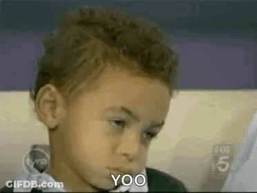 Boy Sitting On Couch Making Funny Face Saying Yoo GIF