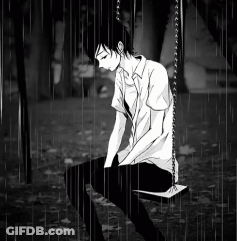 Boy Sitting On Swing In Rain GIF