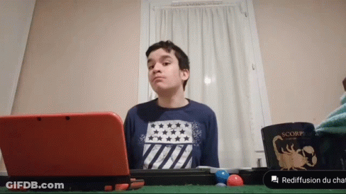 Boy Sitting With Red Nintendo 3DS And Scorpion Mug GIF