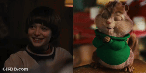 Boy Smiling Next To Chipmunk In Green Shirt GIF