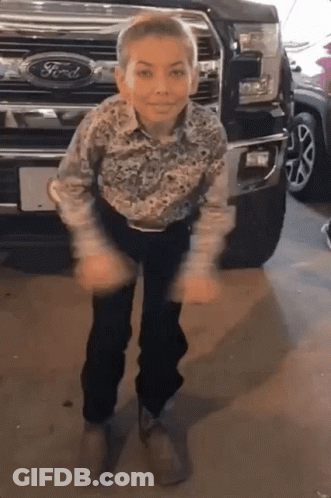 Boy Standing In Front Of Ford Truck GIF