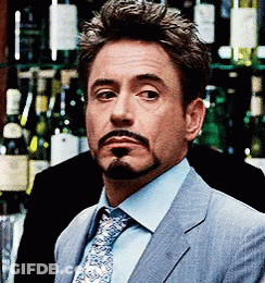Boy Sticking Tongue Out In Front Of Parental Advisory Poster GIF