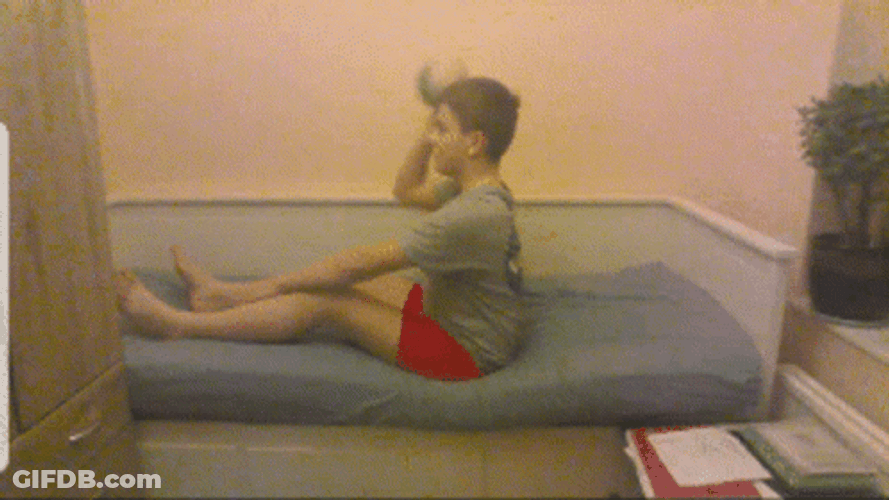 Boy Throwing Computer While Sitting GIF