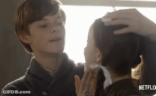 Boy Touching Girl's Forehead In Netflix Ad GIF