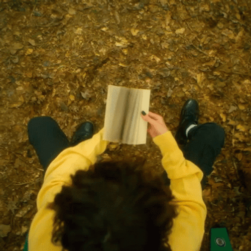Boy Turning Flipbook Pages GIF