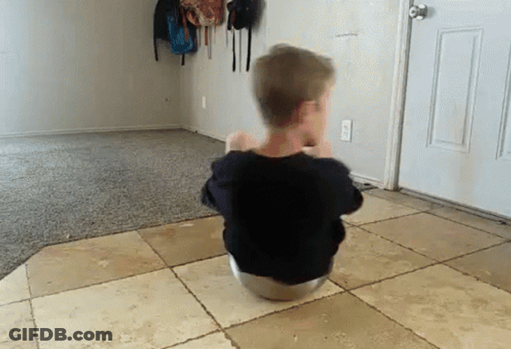 Boy Using Kitchen Bowl As Spinner GIF