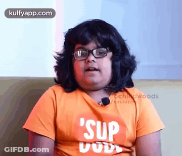 Boy Wearing Glasses And Orange Shirt Saying Sup Dude GIF